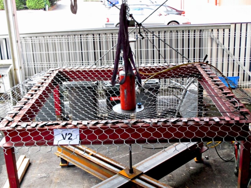 Professional quality control testing for metal fence tensile strength in a Chinese factory laboratory